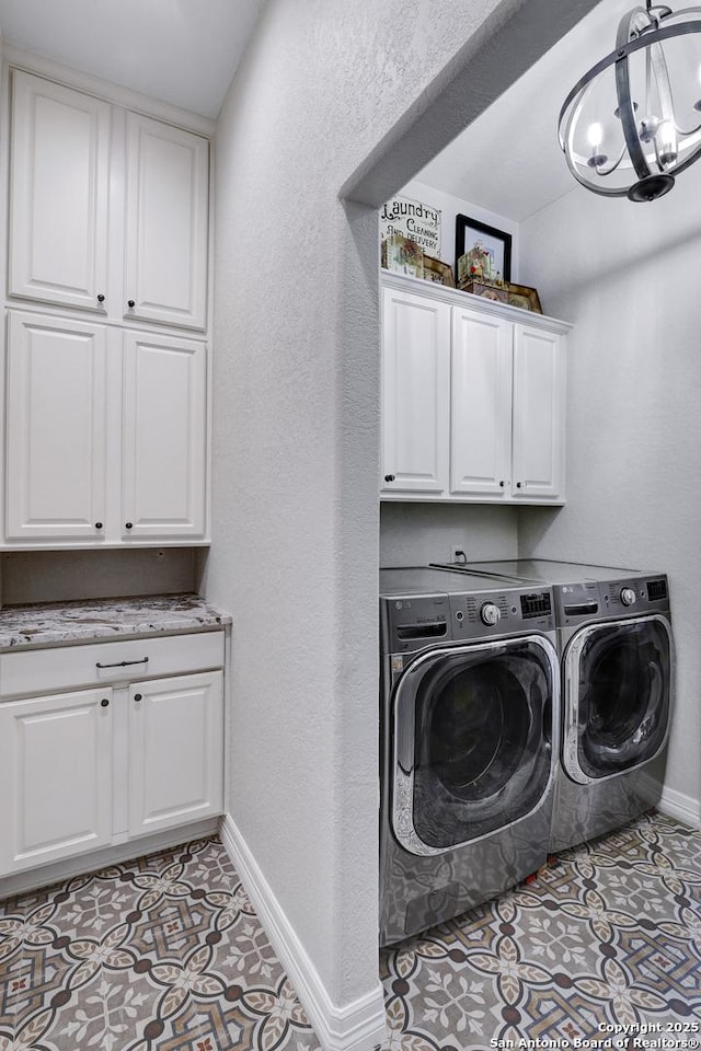 11 Gemsbuck Rise, San Antonio, TX 78258 - washroom with cabinet space, washing machine and clothes dryer, baseboards, a chandelier, and tile patterned floors
