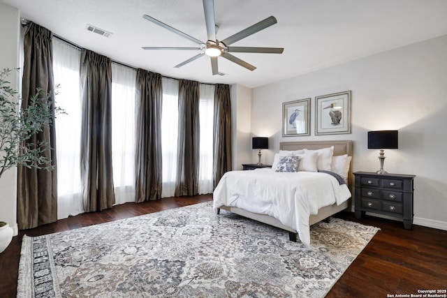11 Gemsbuck Rise, San Antonio, TX 78258 - bedroom with wood finished floors, baseboards, and a ceiling fan