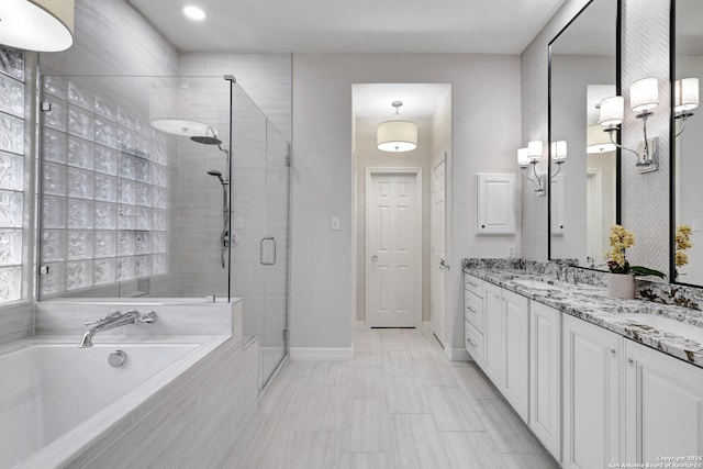 11 Gemsbuck Rise, San Antonio, TX 78258 - bathroom with a shower stall, a garden tub, double vanity, and baseboards
