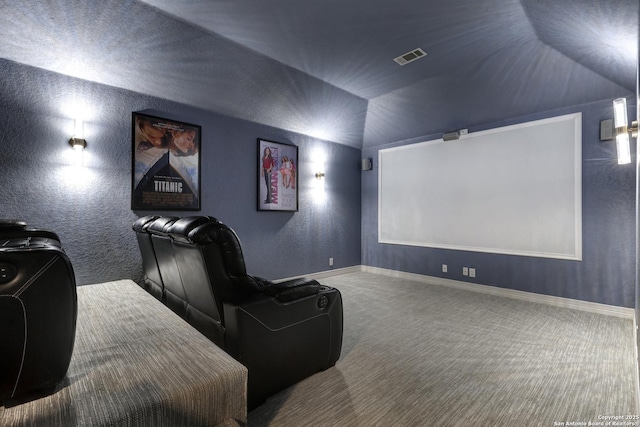 11 Gemsbuck Rise, San Antonio, TX 78258 - carpeted home theater featuring a textured wall, vaulted ceiling, and baseboards