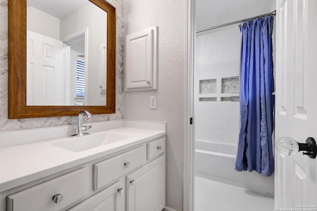 11 Gemsbuck Rise, San Antonio, TX 78258 - bathroom featuring vanity, a textured wall, and shower / tub combo with curtain
