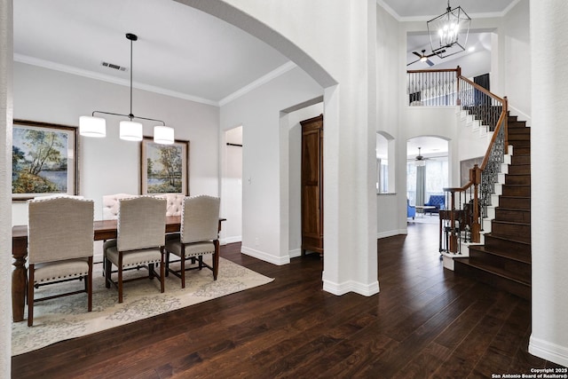11 Gemsbuck Rise, San Antonio, TX 78258 - dining room with arched walkways, hardwood / wood-style floors, stairs, a chandelier, and ornamental molding