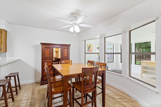 305 Rockmoor Dr, Georgetown, TX 78628 - dining space featuring light wood-style floors, ceiling fan, and baseboards