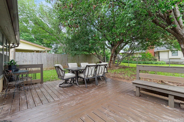 305 Rockmoor Dr, Georgetown, TX 78628 - wooden terrace with outdoor dining area and a fenced backyard