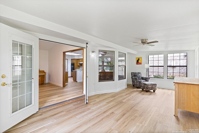 305 Rockmoor Dr, Georgetown, TX 78628 - sitting room featuring ceiling fan, light wood-style flooring, and baseboards