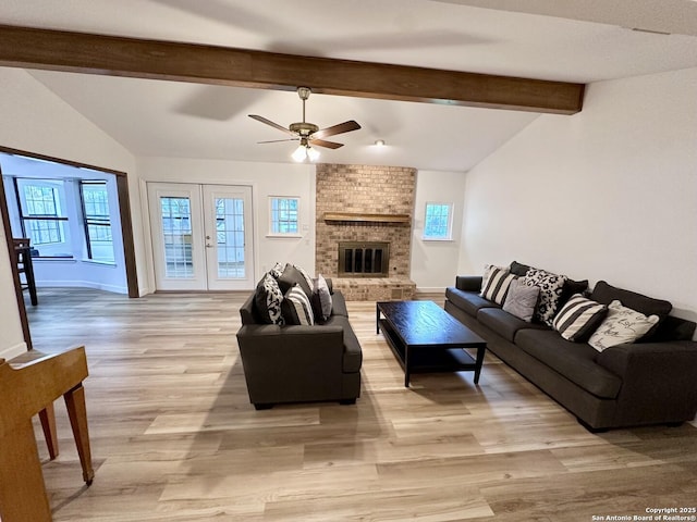 305 Rockmoor Dr, Georgetown, TX 78628 - living area with a ceiling fan, light wood-style floors, baseboards, and a brick fireplace