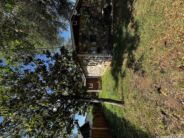 19518 Florence, Lytle, TX 78052 - view of side of home featuring stone siding