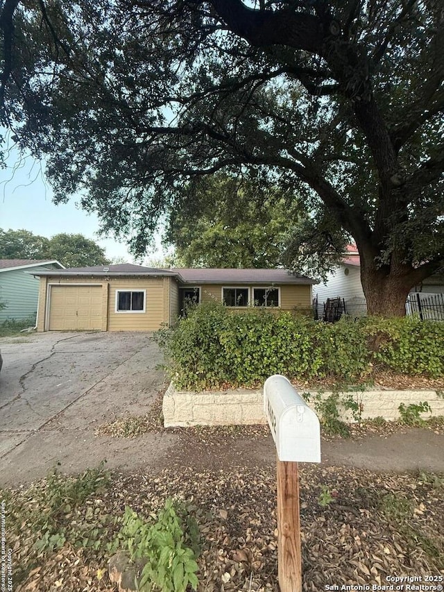 4402 Dove Spgs, Austin, TX 78744 - view of front of property featuring a garage and concrete driveway