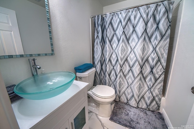 3512 Mcalister, Schertz, TX 78154 - full bathroom with toilet, vanity, curtained shower, a textured wall, and marble look tile flooring