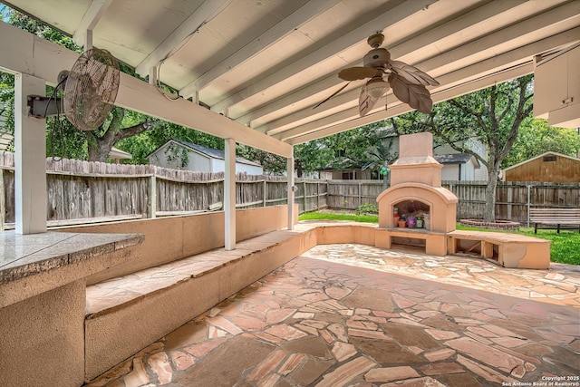 3512 Mcalister, Schertz, TX 78154 - fenced backyard featuring an outdoor fireplace, a patio, and a ceiling fan