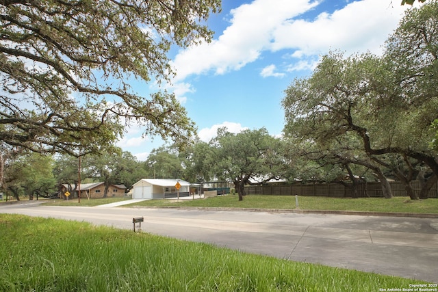 102 Southgate, Pleasanton, TX 78064 - view of concrete street with traffic signs and curbs