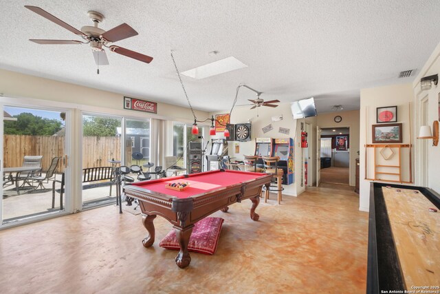 102 Southgate, Pleasanton, TX 78064 - playroom featuring ceiling fan, a textured ceiling, billiards table, a skylight, and concrete flooring