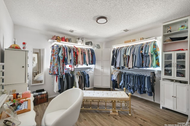 102 Southgate, Pleasanton, TX 78064 - walk in closet with wood finished floors