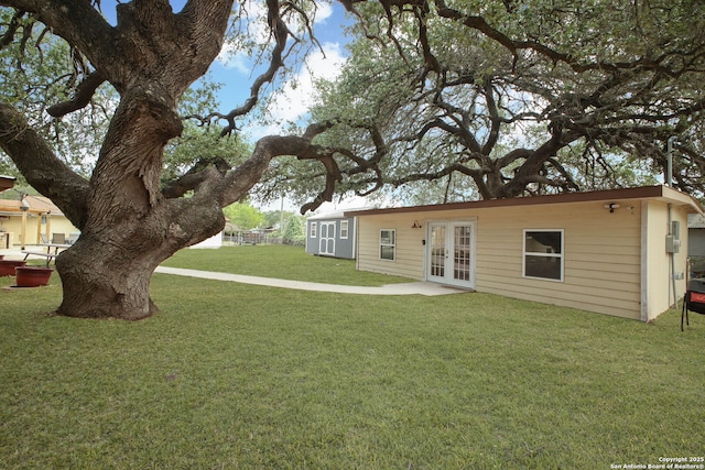 102 Southgate, Pleasanton, TX 78064 - back of property featuring french doors and a yard