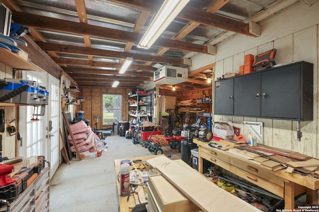 102 Southgate, Pleasanton, TX 78064 - garage featuring a workshop area and a heating unit