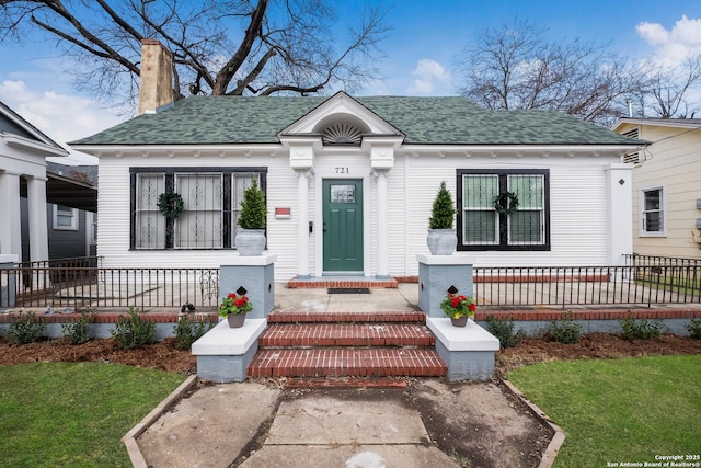 721 W Kings Hwy, San Antonio, TX 78212 - view of front of house featuring a porch, roof with shingles, and a chimney