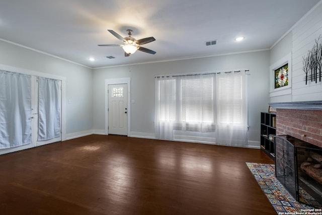 721 W Kings Hwy, San Antonio, TX 78212 - unfurnished living room featuring wood finished floors, a fireplace, ceiling fan, ornamental molding, and baseboards
