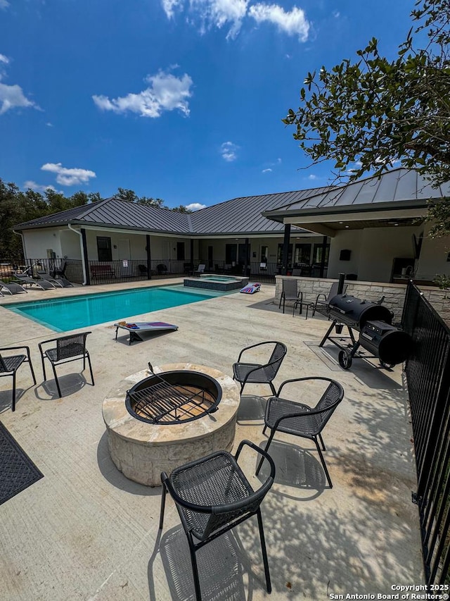 34 Lazy Day, Concan, TX 78838 - community pool with a fire pit and a patio