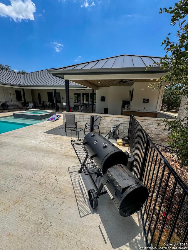 34 Lazy Day, Concan, TX 78838 - view of patio / terrace with an in-ground hot tub