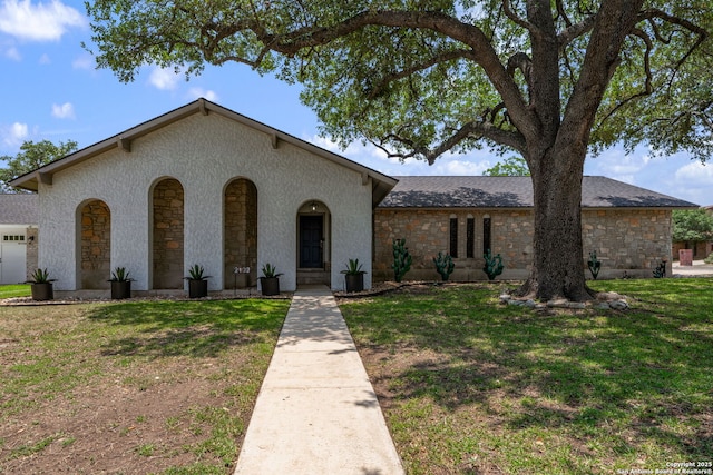 2102 Oak Wild St, San Antonio, TX 78232 - view of front of property with stone siding and a front lawn