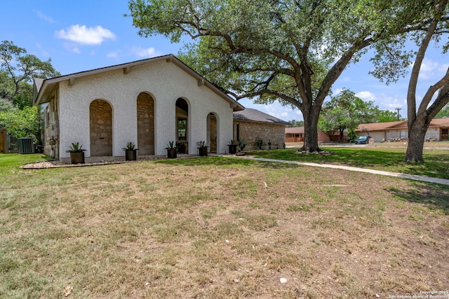 2102 Oak Wild St, San Antonio, TX 78232 - view of front facade featuring central AC, a front lawn, and stucco siding