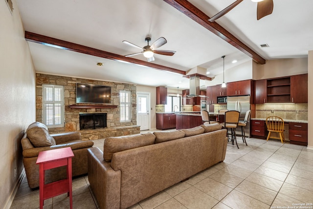 2102 Oak Wild St, San Antonio, TX 78232 - living room featuring ceiling fan, a fireplace, and light tile patterned floors