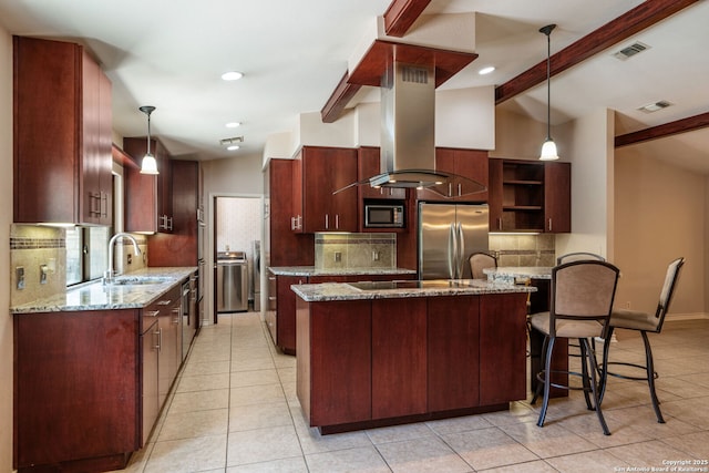 2102 Oak Wild St, San Antonio, TX 78232 - kitchen featuring freestanding refrigerator, built in microwave, a sink, island range hood, and a kitchen island