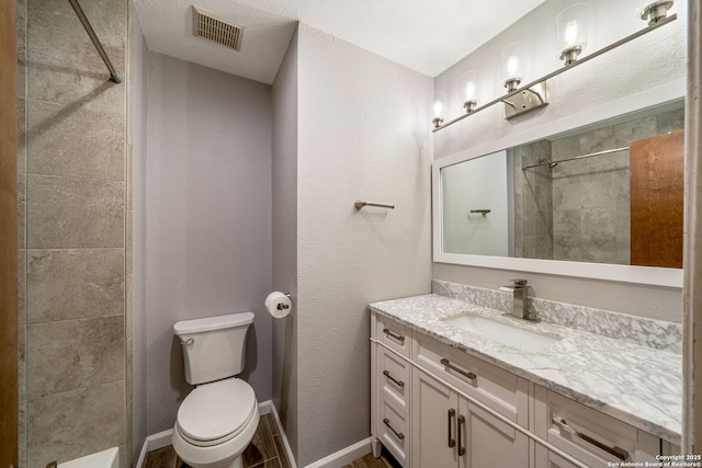 2102 Oak Wild St, San Antonio, TX 78232 - full bath with vanity, a tile shower, and toilet