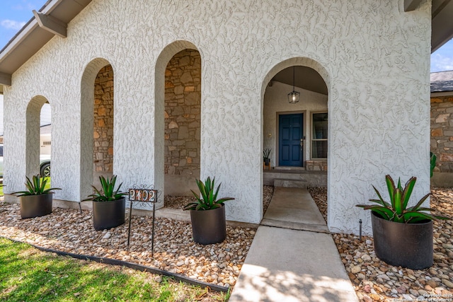 2102 Oak Wild St, San Antonio, TX 78232 - view of exterior entry featuring stucco siding and stone siding