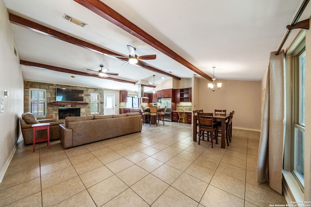 2102 Oak Wild St, San Antonio, TX 78232 - living room featuring light tile patterned floors, a stone fireplace, baseboards, and a ceiling fan
