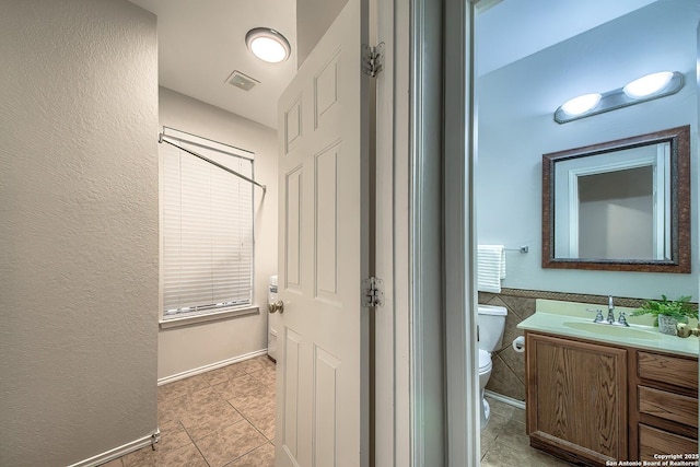 112 Springtree Bnd, Cibolo, TX 78108 - bathroom featuring toilet, tile patterned floors, and vanity