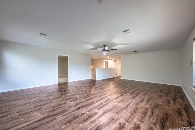 112 Springtree Bnd, Cibolo, TX 78108 - unfurnished living room with dark wood-style floors, a ceiling fan, and baseboards