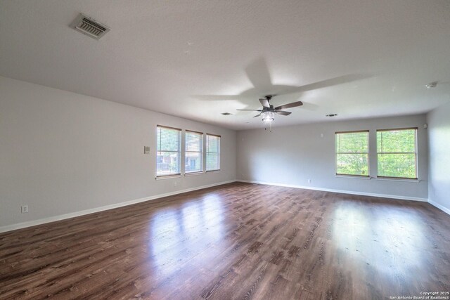 112 Springtree Bnd, Cibolo, TX 78108 - empty room with ceiling fan, dark wood-style floors, baseboards, and a smoke detector