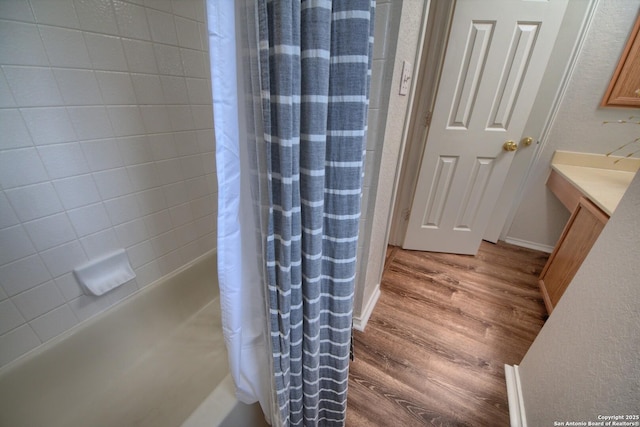 112 Springtree Bnd, Cibolo, TX 78108 - bathroom featuring wood finished floors, vanity, and shower / bathtub combination with curtain