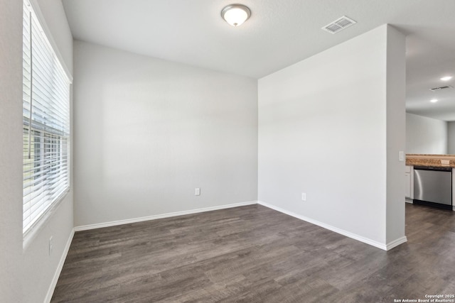 7150 Pisces, Converse, TX 78109 - unfurnished room with healthy amount of natural light, dark wood-type flooring, baseboards, and recessed lighting