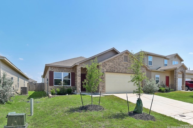 7150 Pisces, Converse, TX 78109 - view of front of house with central AC unit, an attached garage, brick siding, and driveway
