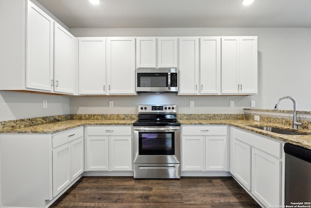 7150 Pisces, Converse, TX 78109 - kitchen with appliances with stainless steel finishes, a sink, white cabinets, and recessed lighting