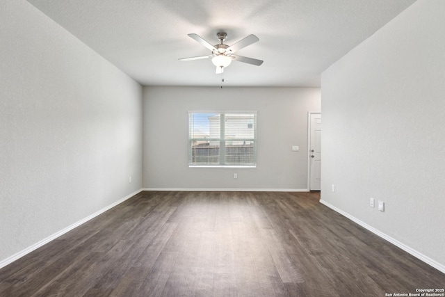 7150 Pisces, Converse, TX 78109 - empty room with dark wood-style flooring, a ceiling fan, and baseboards