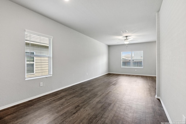 7150 Pisces, Converse, TX 78109 - spare room with ceiling fan, dark wood-type flooring, and baseboards