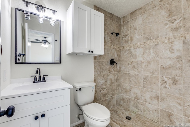 2602 Leslie Nicole, San Antonio, TX 78237 - full bath with tiled shower, vanity, toilet, a textured ceiling, and a ceiling fan