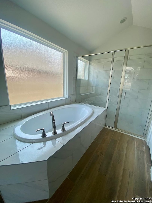 1185 Abelia, New Braunfels, TX 78132 - full bathroom with a bath, a shower stall, wood finished floors, and vaulted ceiling