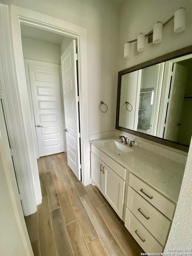 1185 Abelia, New Braunfels, TX 78132 - full bath featuring vanity, wood finished floors, and a shower