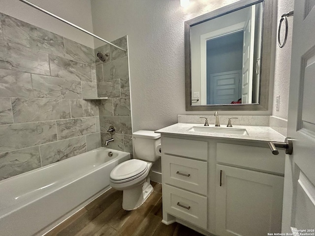 1185 Abelia, New Braunfels, TX 78132 - full bathroom with wood finished floors, a textured wall, shower / tub combination, toilet, and vanity