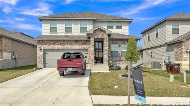 229 Colebrook Way, Cibolo, TX 78108 - townhome / multi-family property with concrete driveway, a front lawn, an attached garage, central AC, and a shingled roof