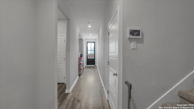 229 Colebrook Way, Cibolo, TX 78108 - hall featuring a textured wall, wood finished floors, baseboards, and recessed lighting