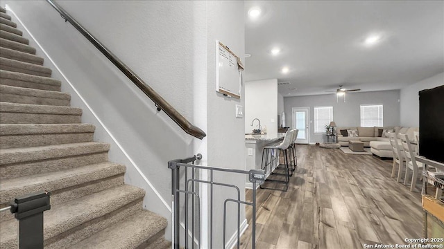 229 Colebrook Way, Cibolo, TX 78108 - stairway with ceiling fan, wood finished floors, and baseboards