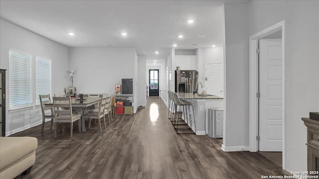 229 Colebrook Way, Cibolo, TX 78108 - dining room with dark wood-style flooring, baseboards, and recessed lighting