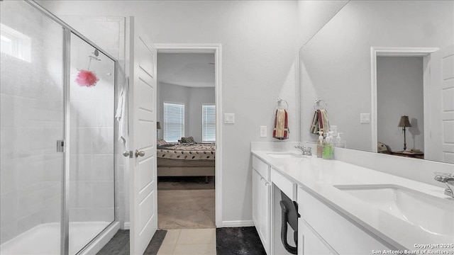 229 Colebrook Way, Cibolo, TX 78108 - ensuite bathroom with double vanity, a shower stall, and tile patterned flooring