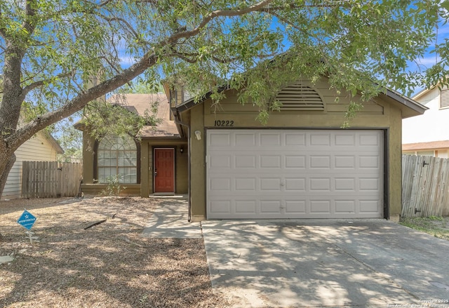 10222 Canton Fld, San Antonio, TX 78245 - view of front of house featuring concrete driveway, stucco siding, and a garage