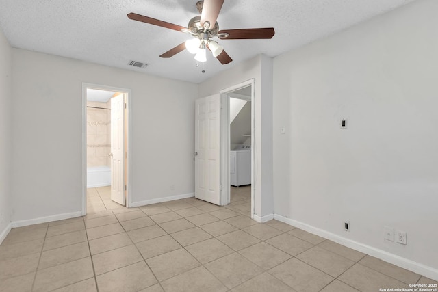 10222 Canton Fld, San Antonio, TX 78245 - spare room featuring washer / clothes dryer, light tile patterned flooring, a textured ceiling, a ceiling fan, and baseboards